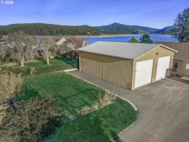 a view of a yard and front view of a house