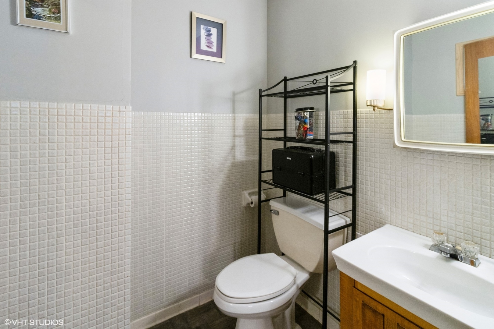 247 South Church Road Bensenville, IL 60106 - Photo 12 of 18 a bathroom with a toilet a sink and mirror
