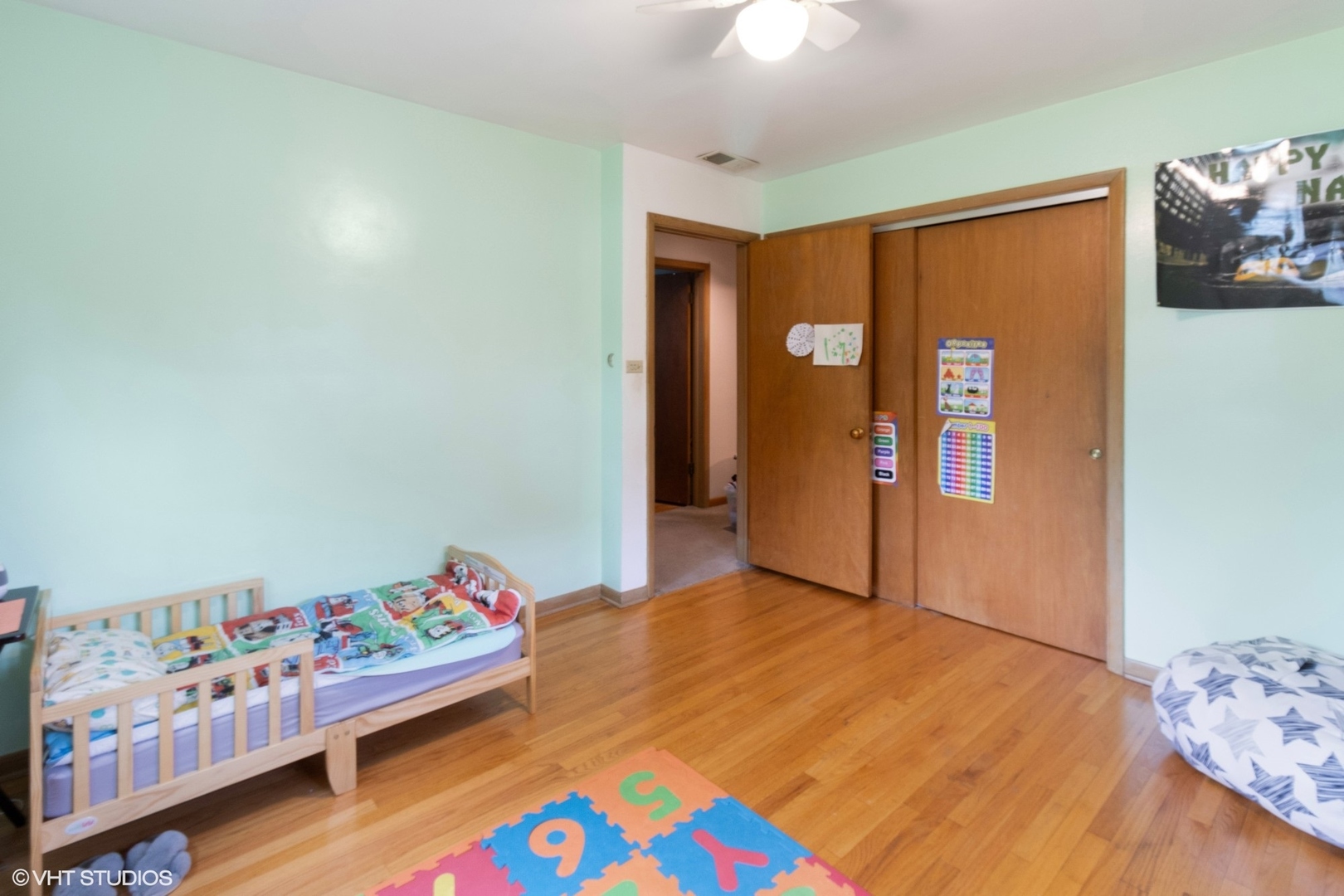 247 South Church Road Bensenville, IL 60106 - Photo 15 of 18 a bedroom with bed and wooden floor