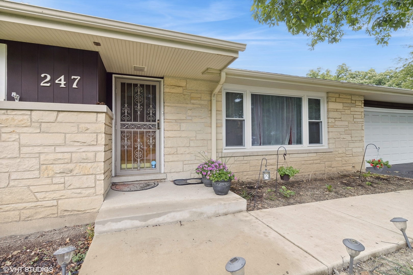 247 South Church Road Bensenville, IL 60106 - Photo 3 of 18 a front view of a house with a garage