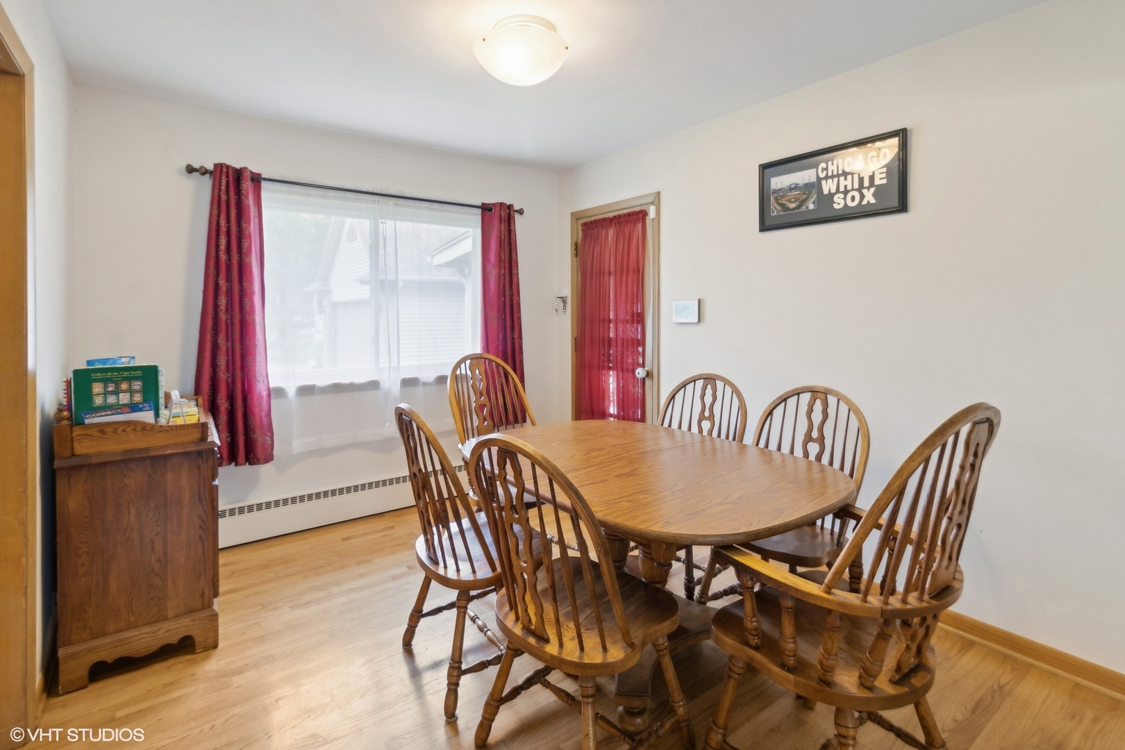247 South Church Road Bensenville, IL 60106 - Photo 6 of 18 a view of a dining room with furniture and a window