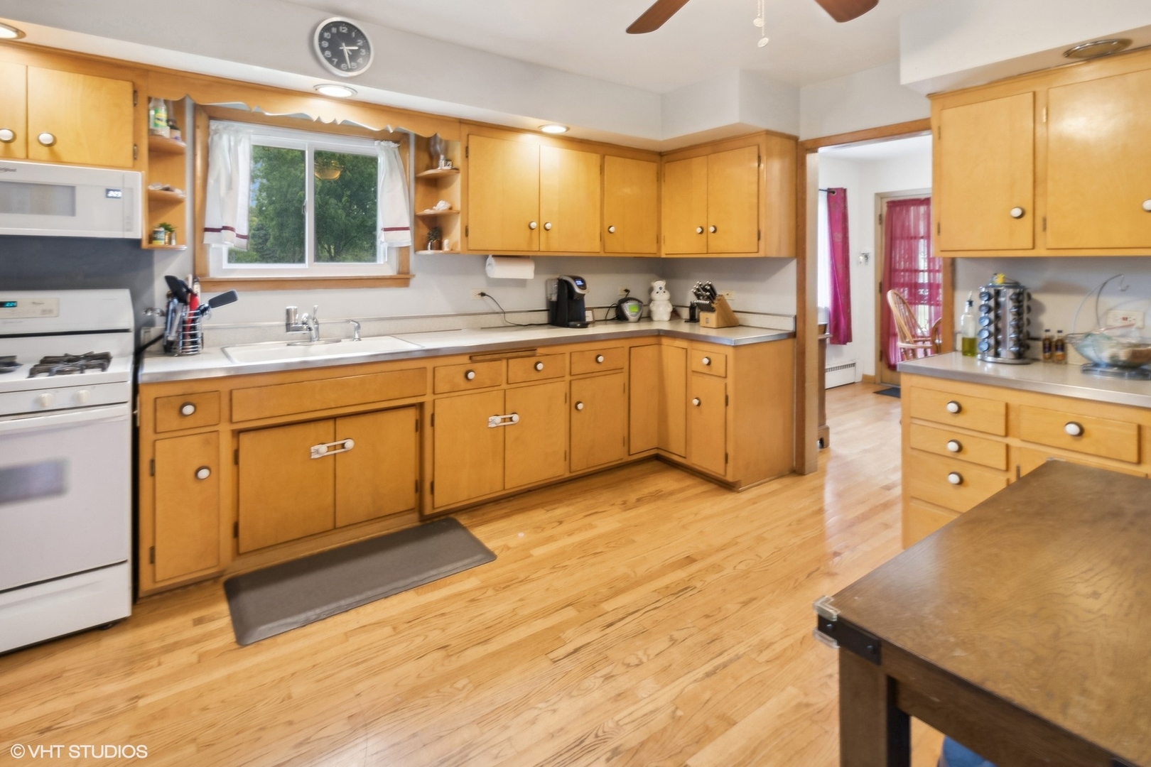 247 South Church Road Bensenville, IL 60106 - Photo 10 of 18 a kitchen with stainless steel appliances granite countertop a stove a sink and a refrigerator