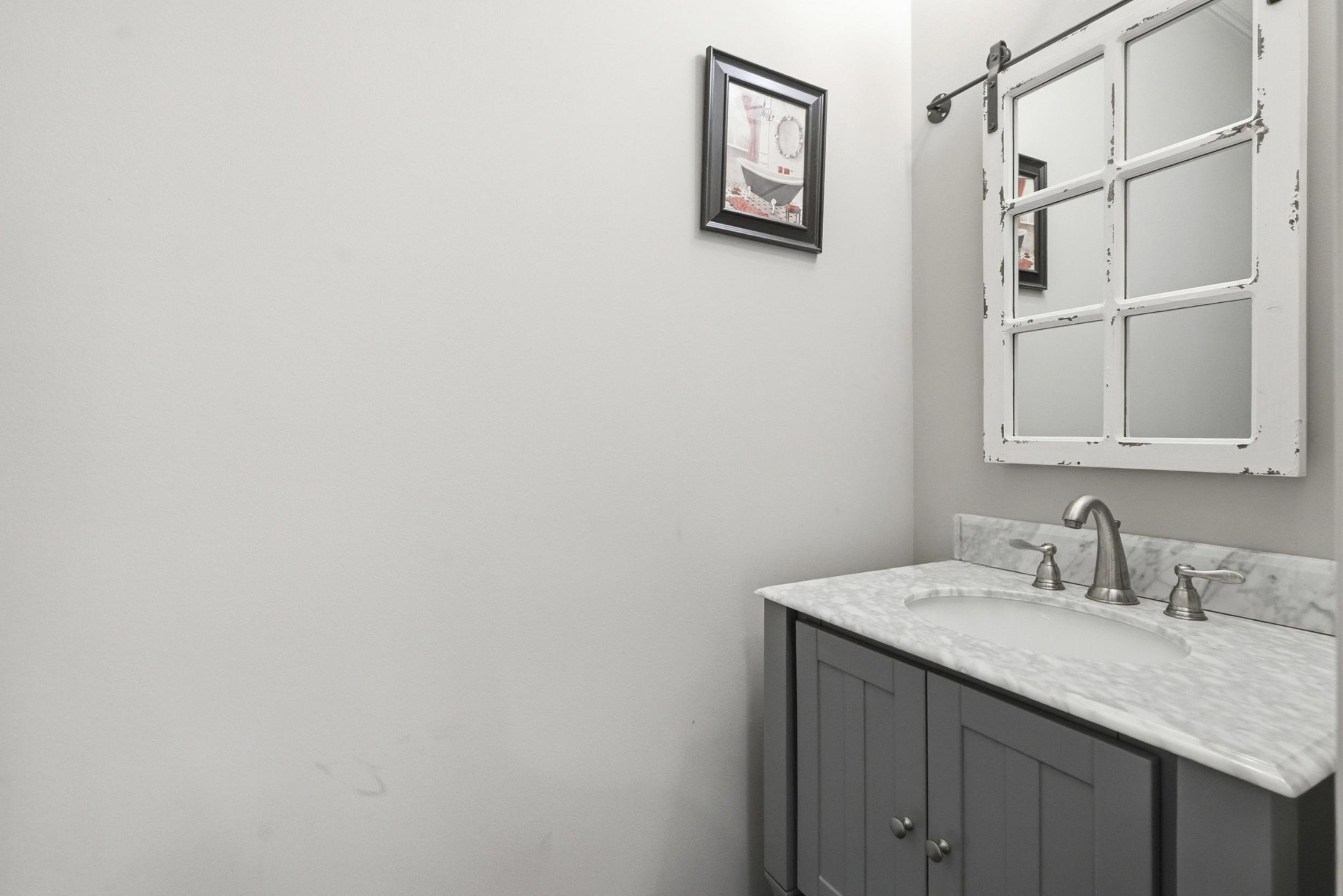 6000 Wallaby Court Spring Hill, TN 37174 - Photo 10 of 57 a bathroom with a granite countertop sink and a mirror