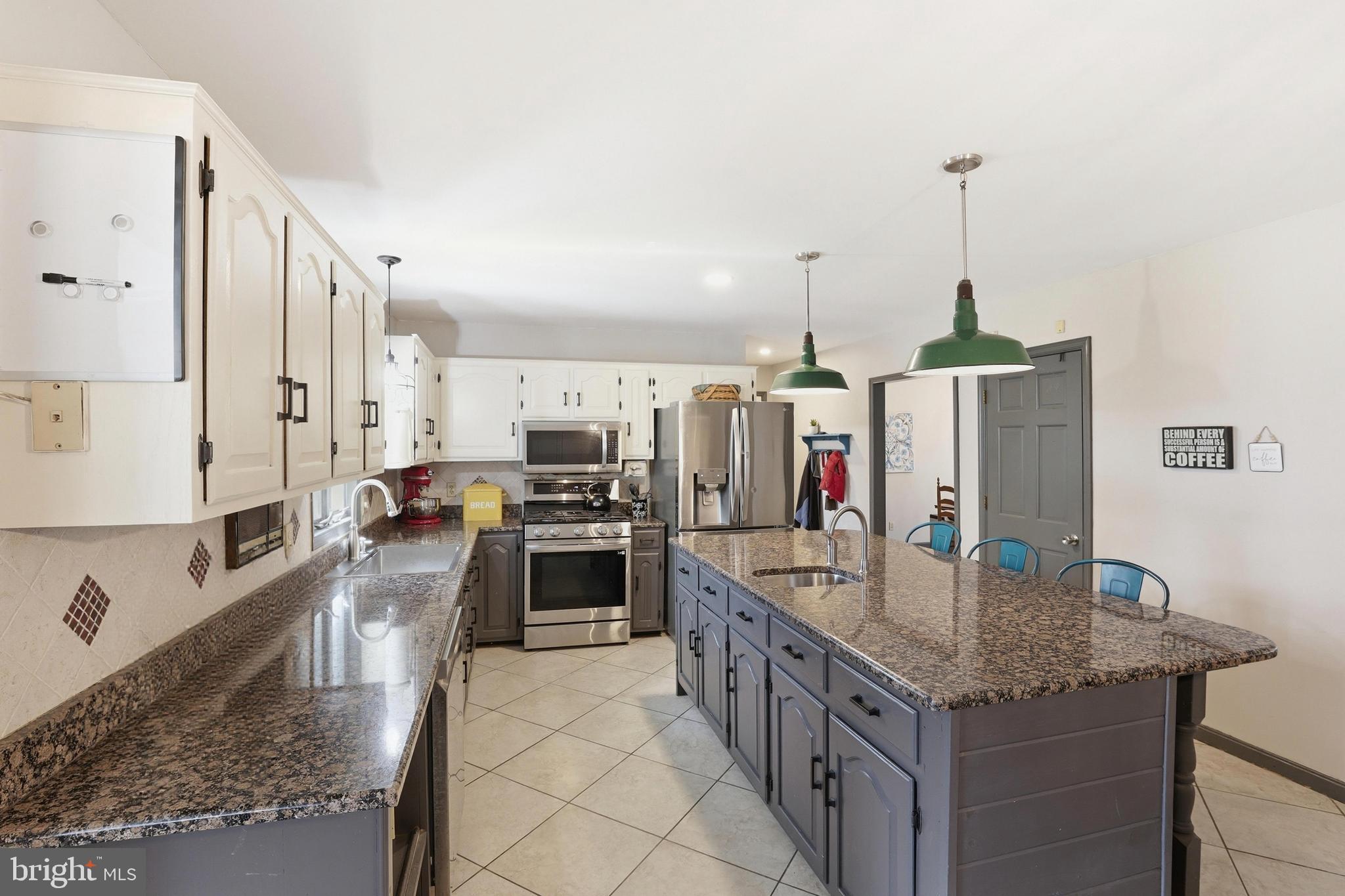 228 Firetower Road Camden Wyoming, DE 19934 - Photo 14 of 39 a kitchen with stainless steel appliances granite countertop a sink counter space and cabinets