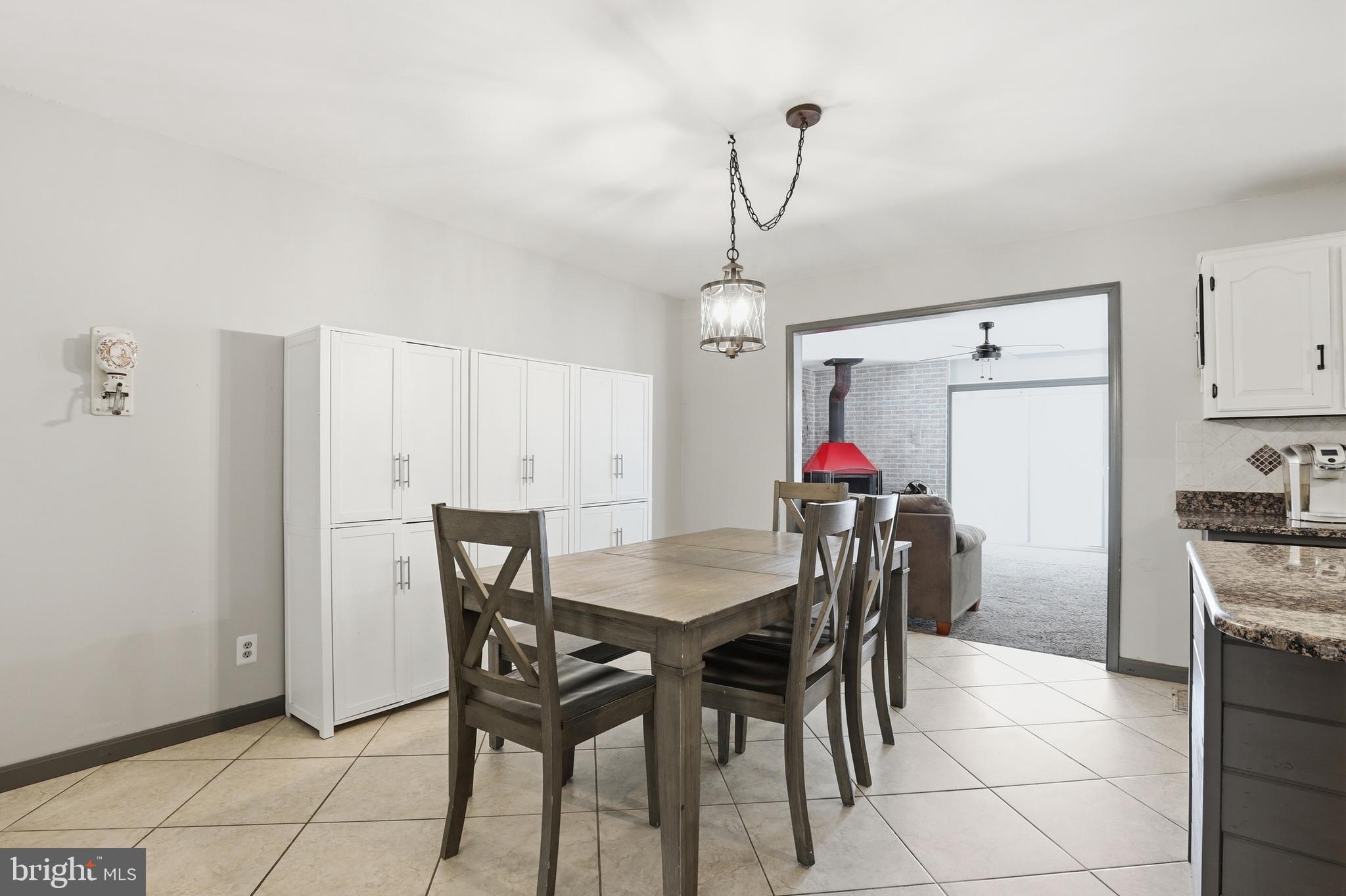 228 Firetower Road Camden Wyoming, DE 19934 - Photo 17 of 39 a view of a dining room with furniture and chandelier