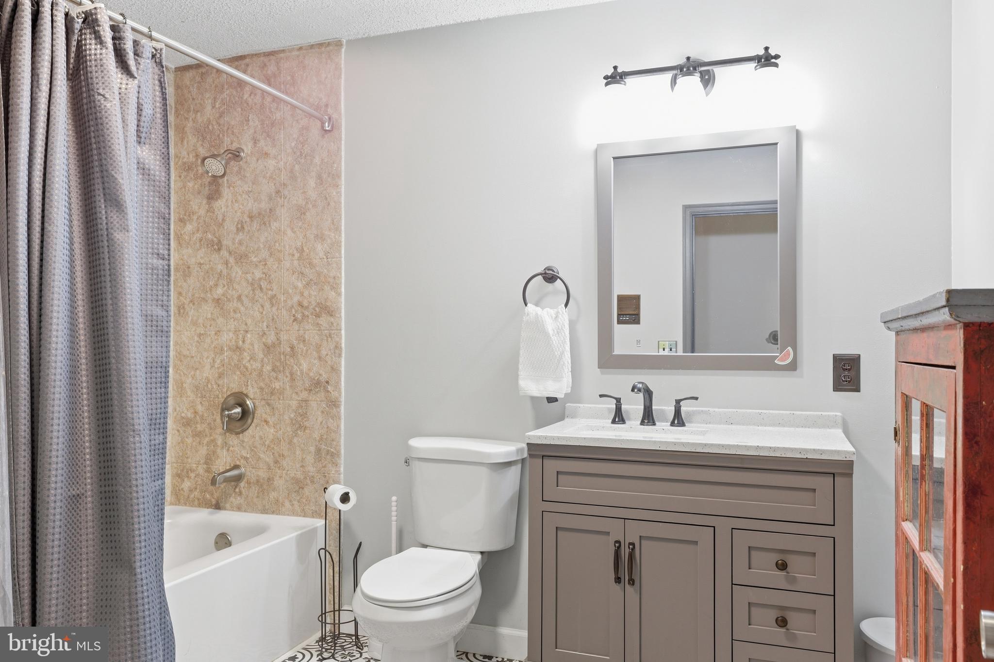 228 Firetower Road Camden Wyoming, DE 19934 - Photo 21 of 39 a bathroom with a sink a toilet and shower
