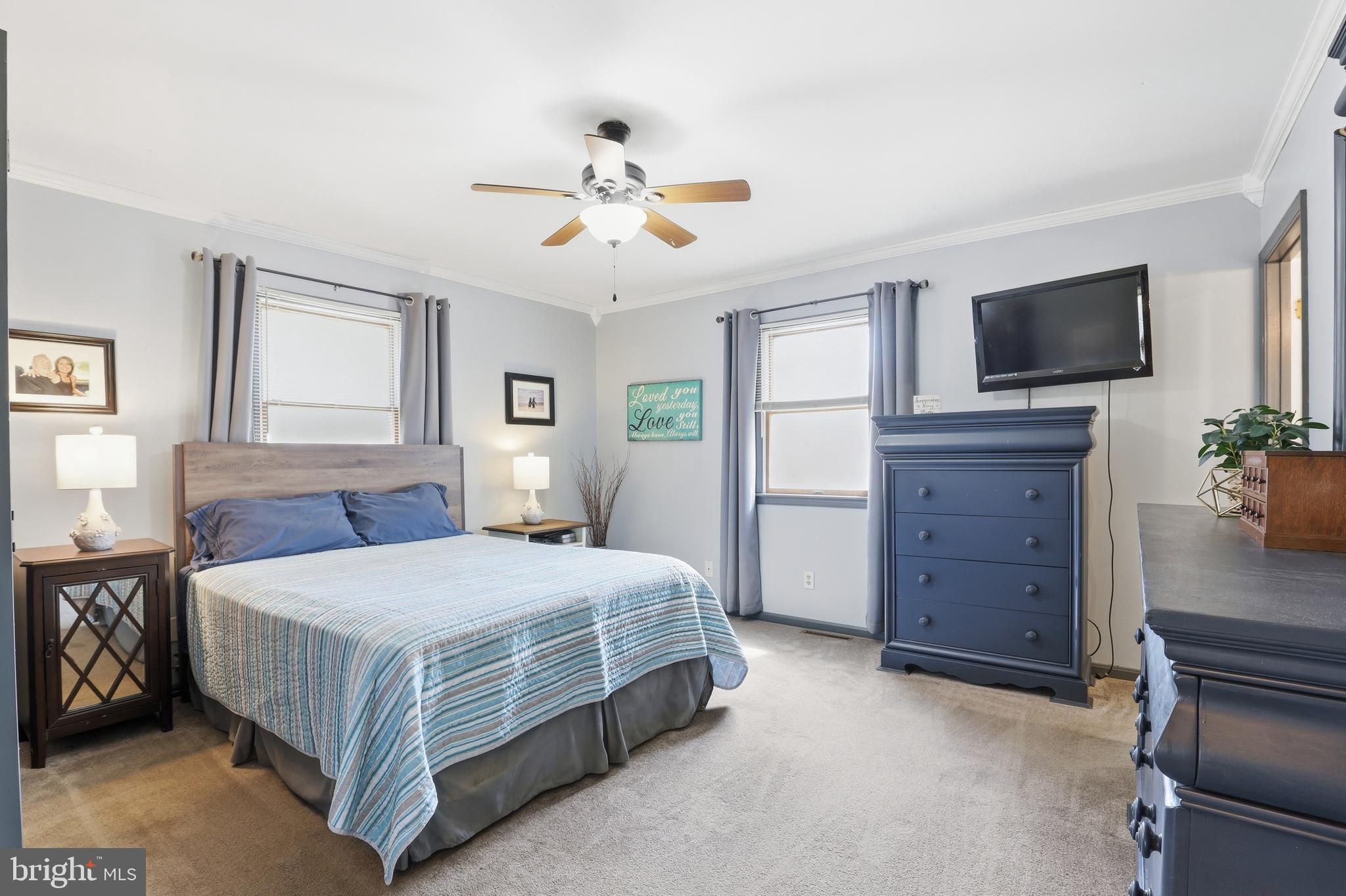 228 Firetower Road Camden Wyoming, DE 19934 - Photo 26 of 39 a bedroom with a bed and a flat screen tv