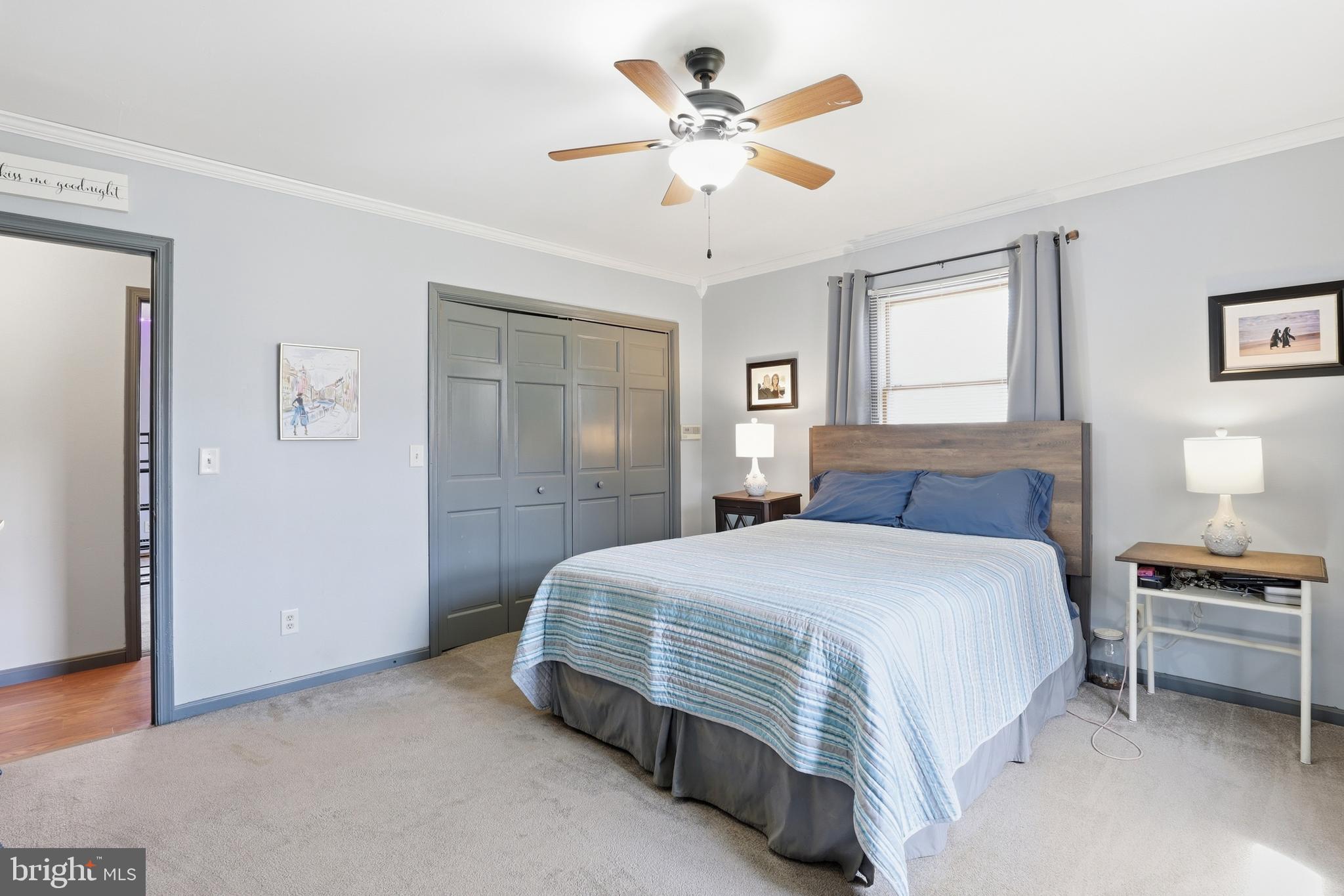 228 Firetower Road Camden Wyoming, DE 19934 - Photo 27 of 39 a bedroom with a bed and a chandelier