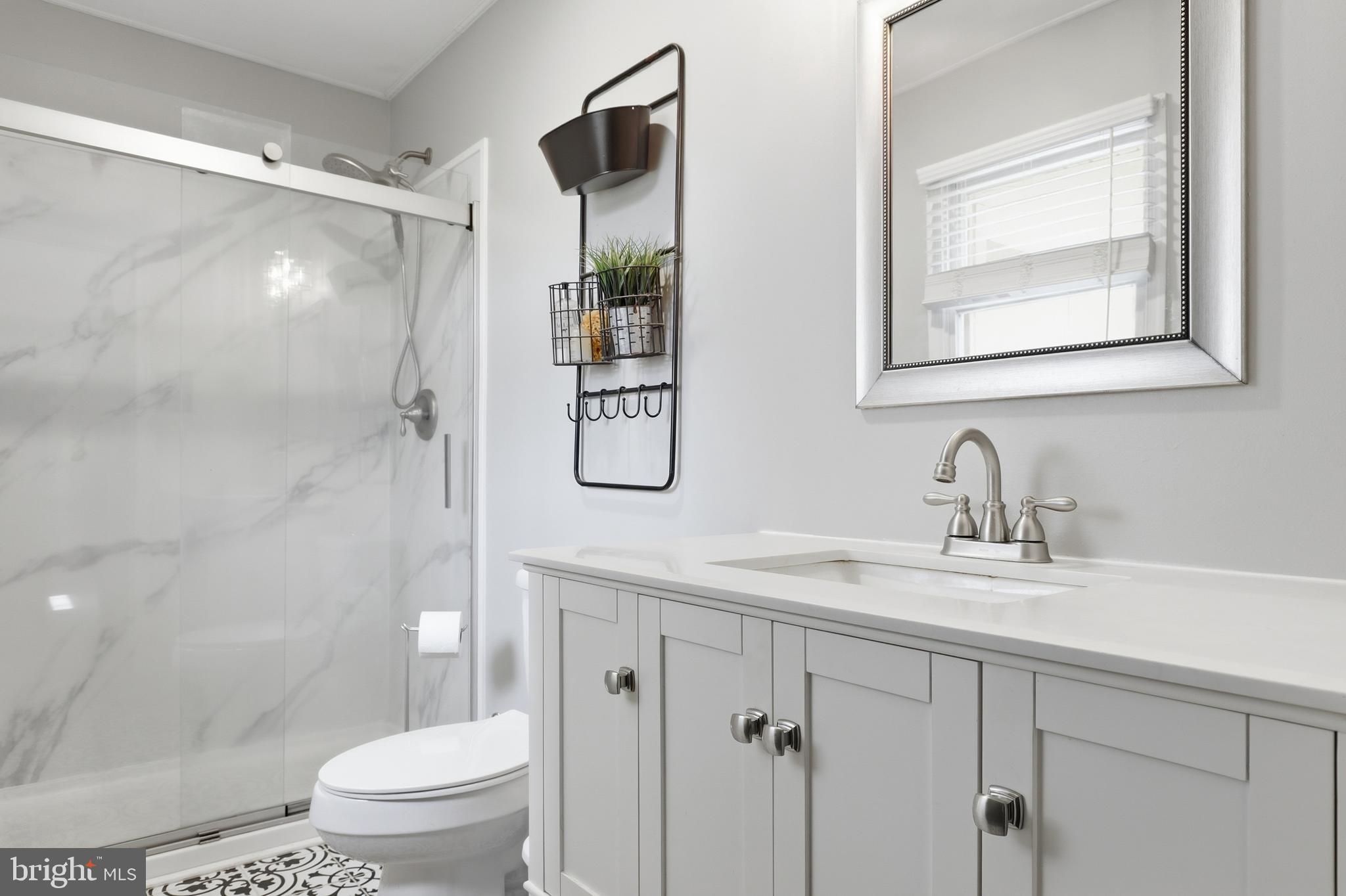 228 Firetower Road Camden Wyoming, DE 19934 - Photo 28 of 39 a bathroom with a granite countertop sink toilet and shower