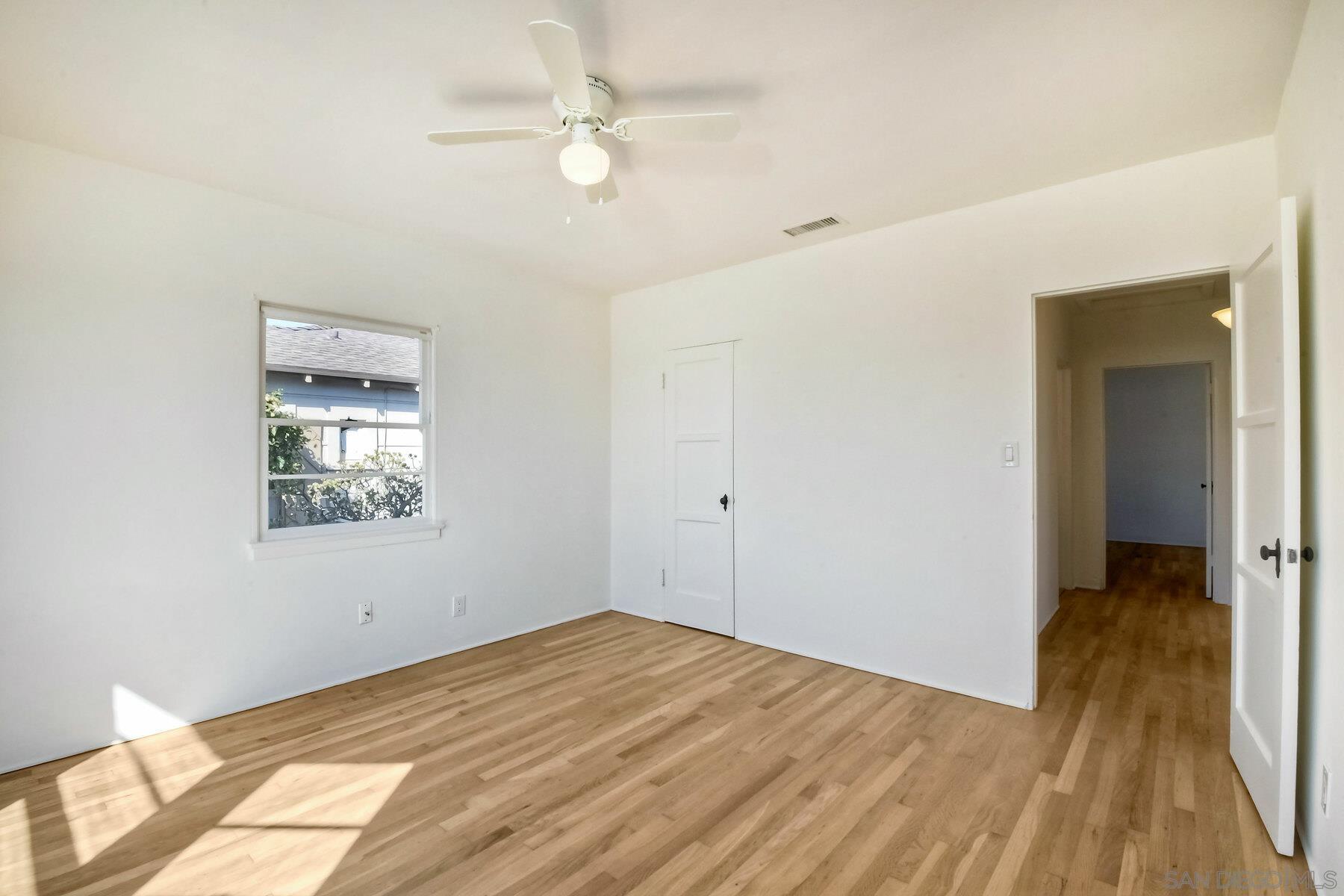 855 Dewitt Avenue Encinitas, CA 92024 - Photo 16 of 23 a view of empty room with wooden floor and fan