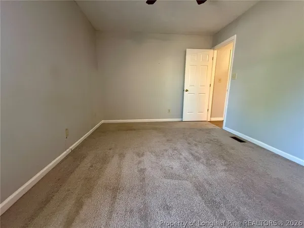 a view of an empty room and window