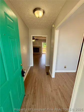 a view of entryway with wooden floor