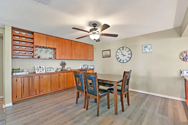 a view of a dining room with furniture and wooden floor