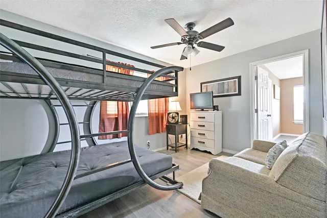 a view of a livingroom with furniture and a ceiling fan