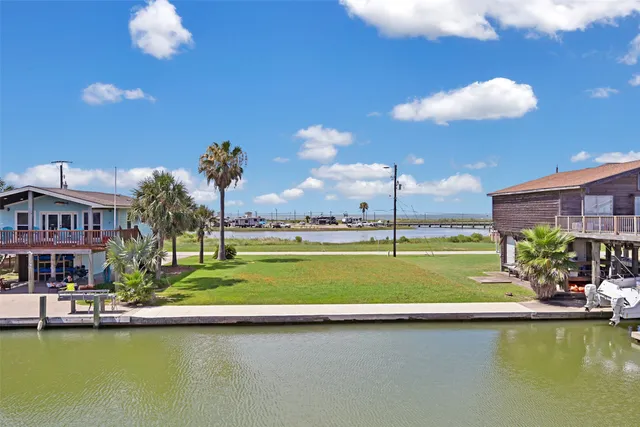 a view of a swimming pool with a yard
