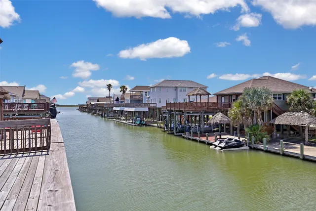 a view of a lake with a table and chairs