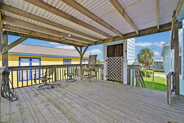 a view of a patio with wooden floor