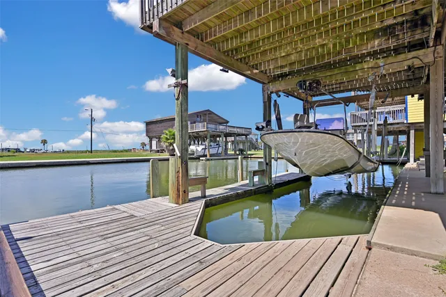 a view of a balcony with two chairs and a table