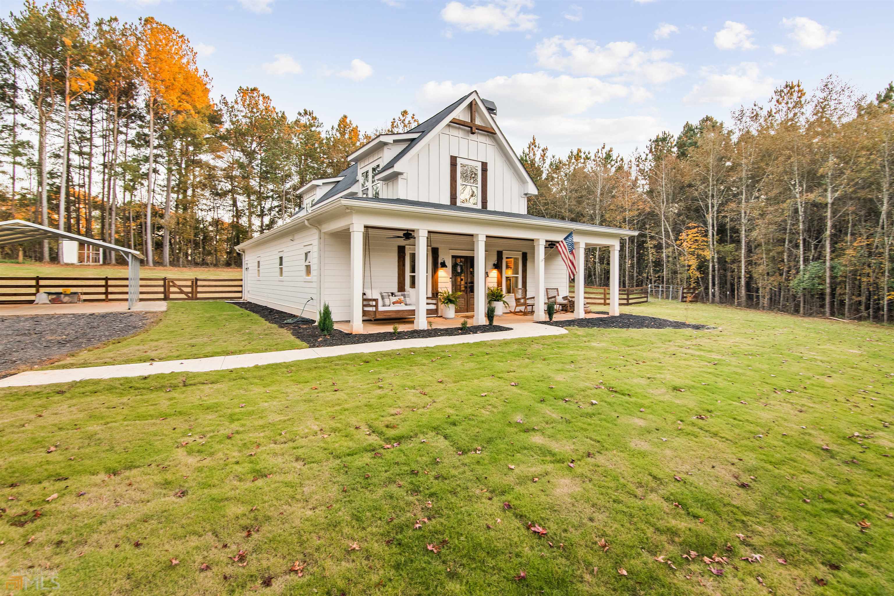 1973 Barton Bridge Road Madison, GA 30650 - Photo 1 of 1 a front view of house with yard and trees in the background