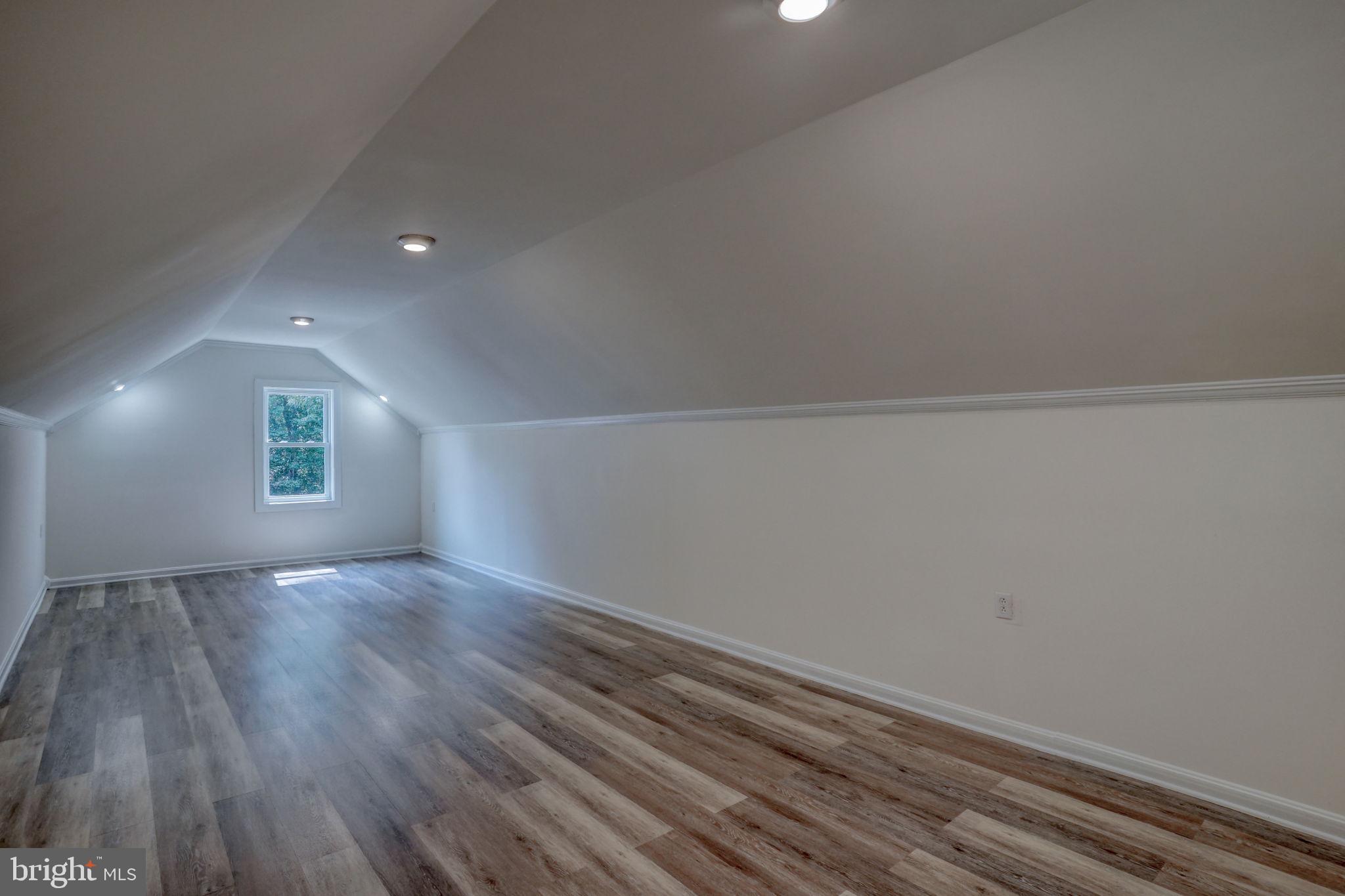 23678 Willow Pond Road Denton, MD 21629 - Photo 31 of 51 a view of empty room with wooden floor and fan