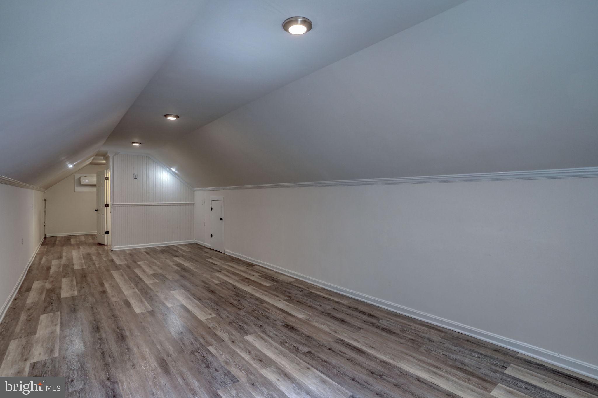 23678 Willow Pond Road Denton, MD 21629 - Photo 32 of 51 a view of an empty room and wooden floor