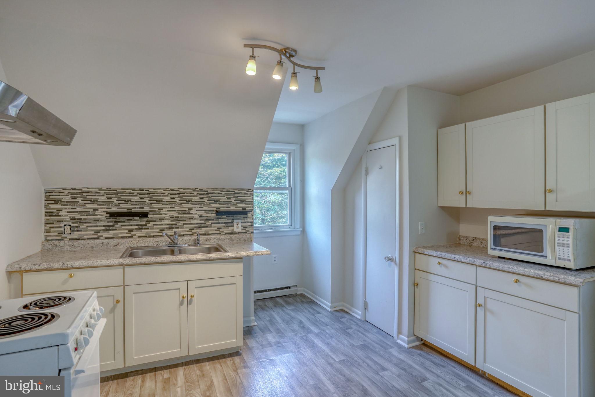 23678 Willow Pond Road Denton, MD 21629 - Photo 38 of 51 a kitchen with stainless steel appliances granite countertop a stove and a refrigerator