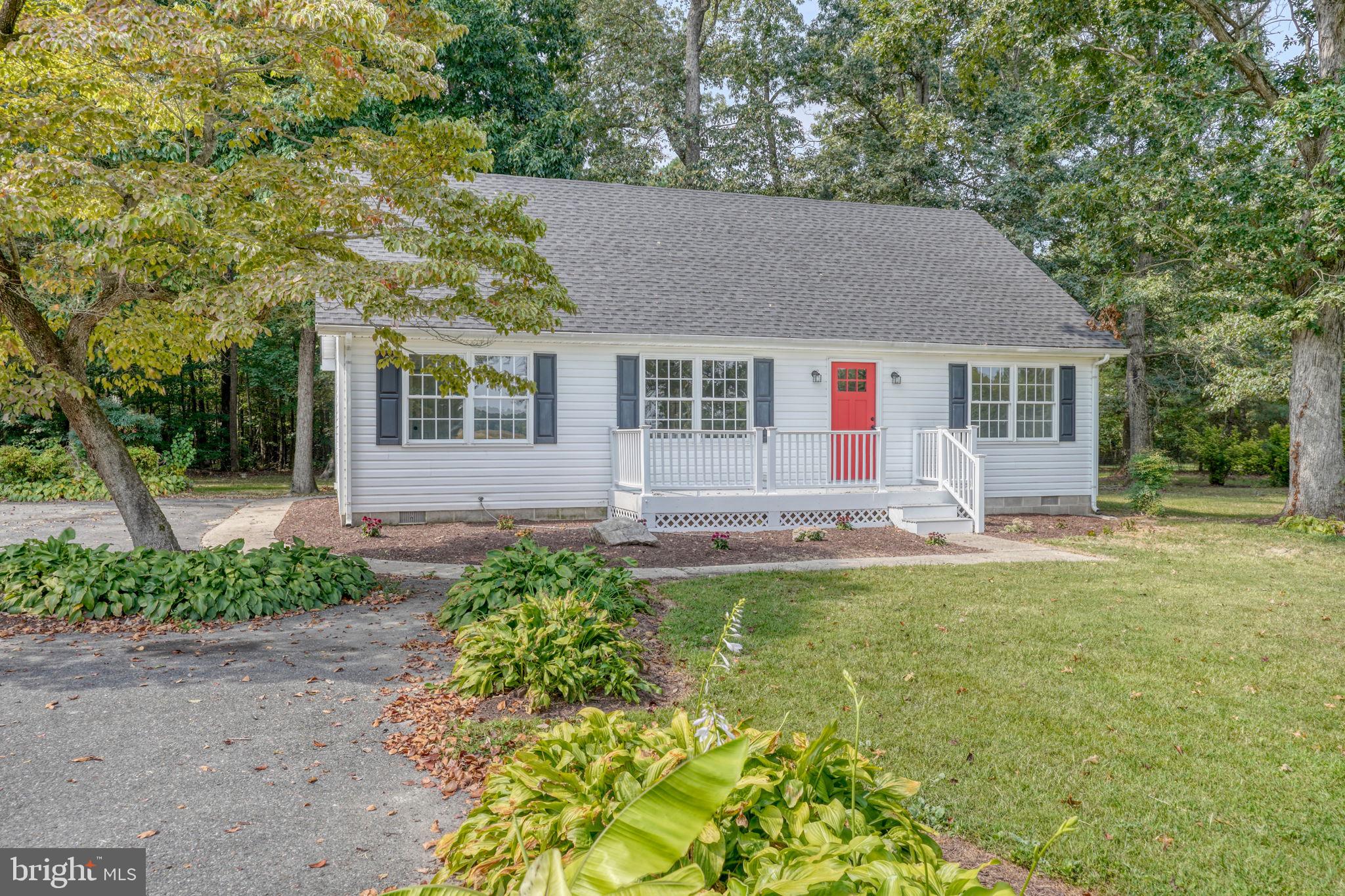 23678 Willow Pond Road Denton, MD 21629 - Photo 4 of 51 a view of a house with a backyard and a tree