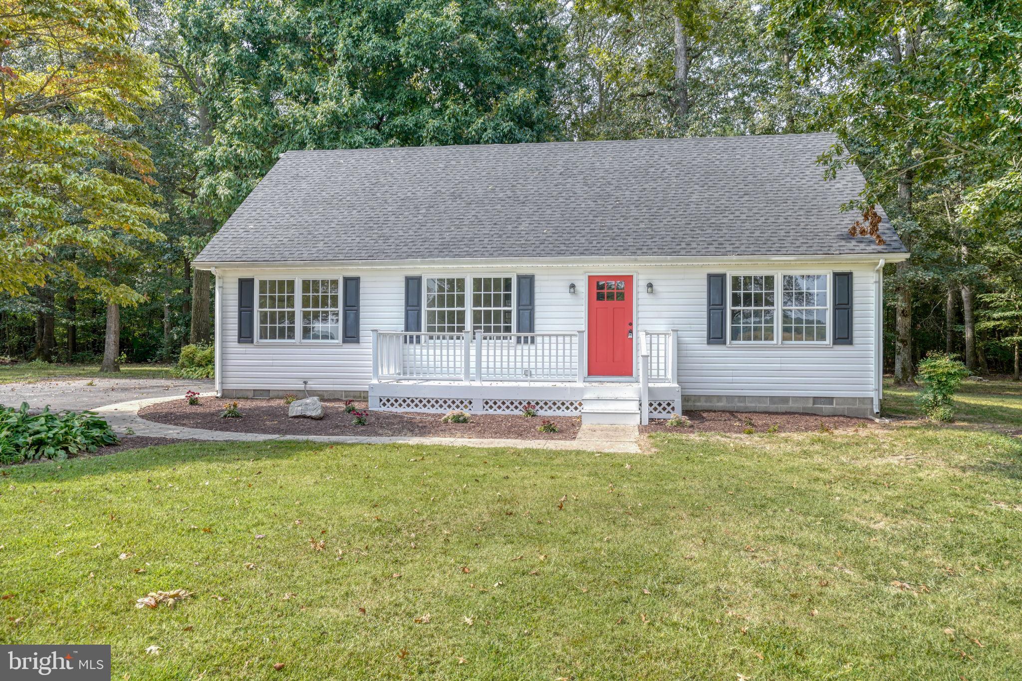 23678 Willow Pond Road Denton, MD 21629 - Photo 7 of 51 a house with swimming pool in front of it