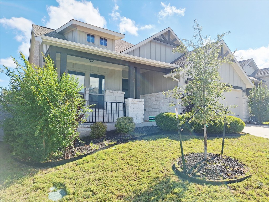 1104 River Vista Road Georgetown, TX 78628 - Photo 2 of 39 a front view of a house with garden