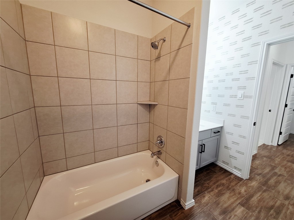 1104 River Vista Road Georgetown, TX 78628 - Photo 33 of 39 a bathroom with a bathtub and a shower