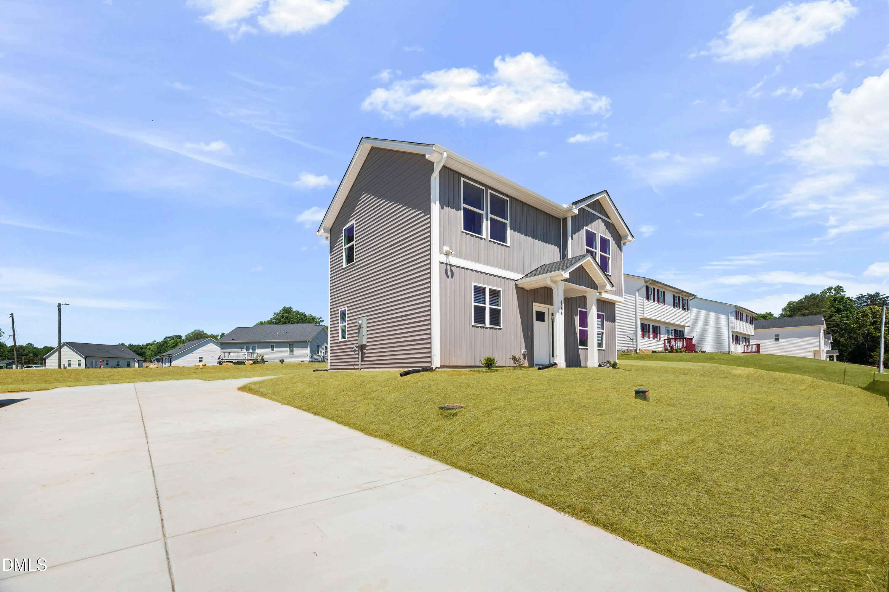 1238 Hurdle Mills Road Roxboro, NC 27573 - Photo 8 of 50 a front view of a house with a yard