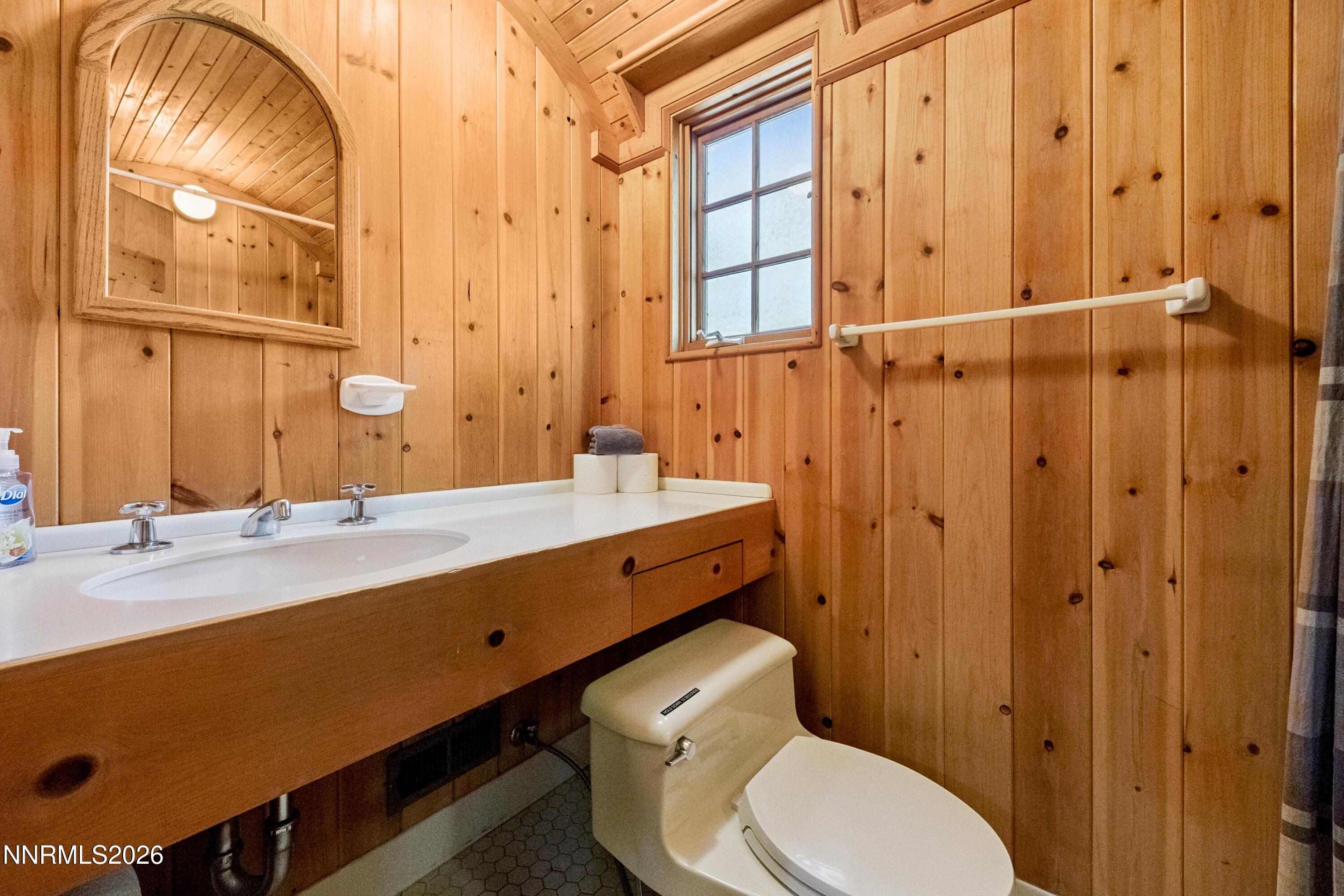 706 Gary Lane, Unit B OR 2 Stateline, NV 89449 - Photo 22 of 26 a bathroom with a sink a toilet and shower