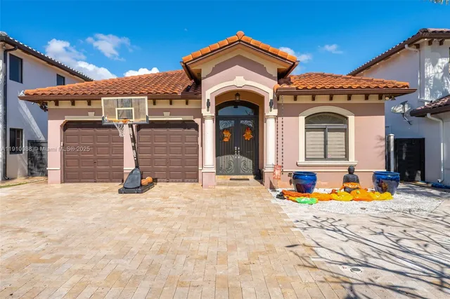 a view of a house with large trees and breakfast area
