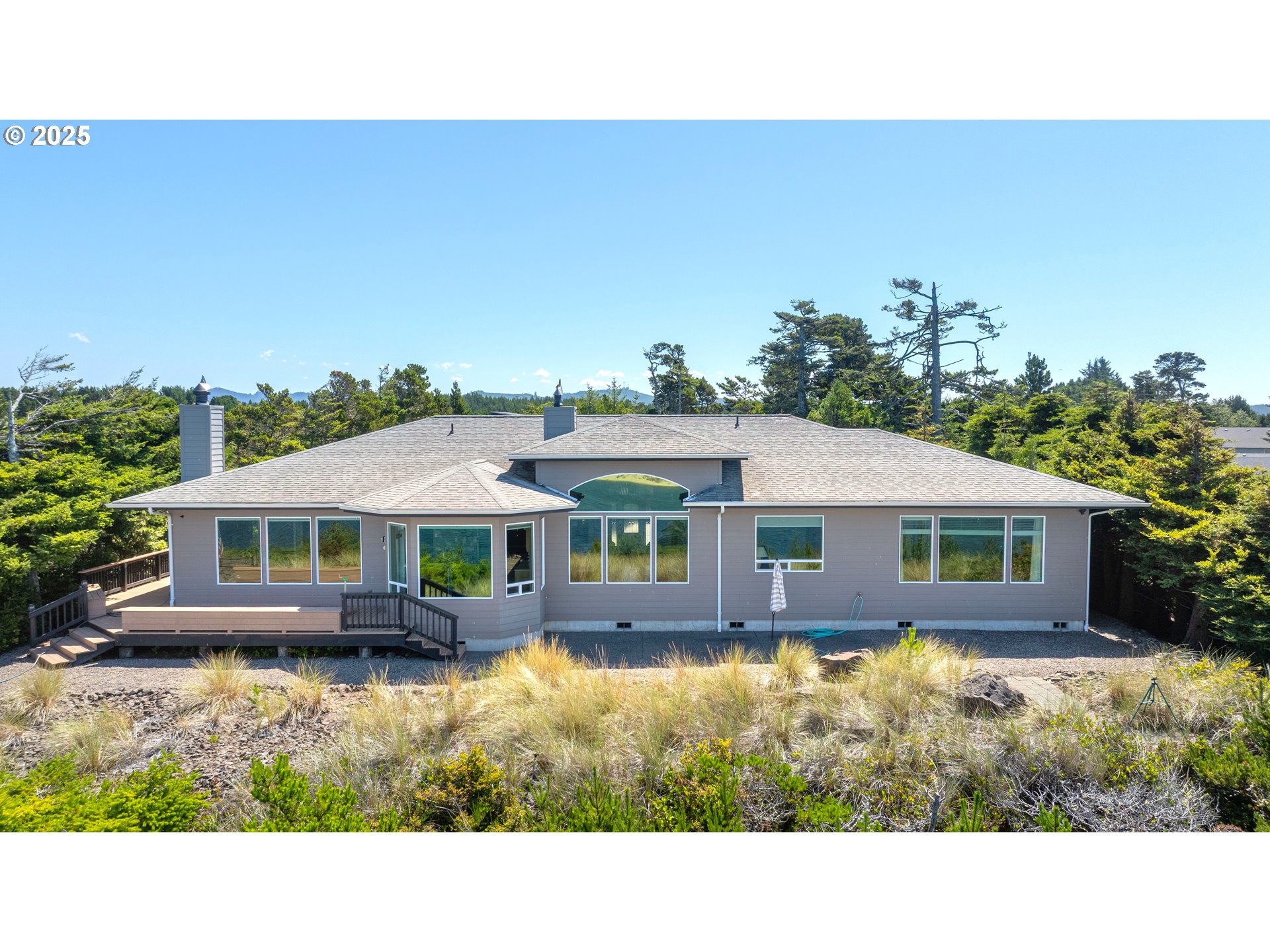 a balcony with furniture and a garden