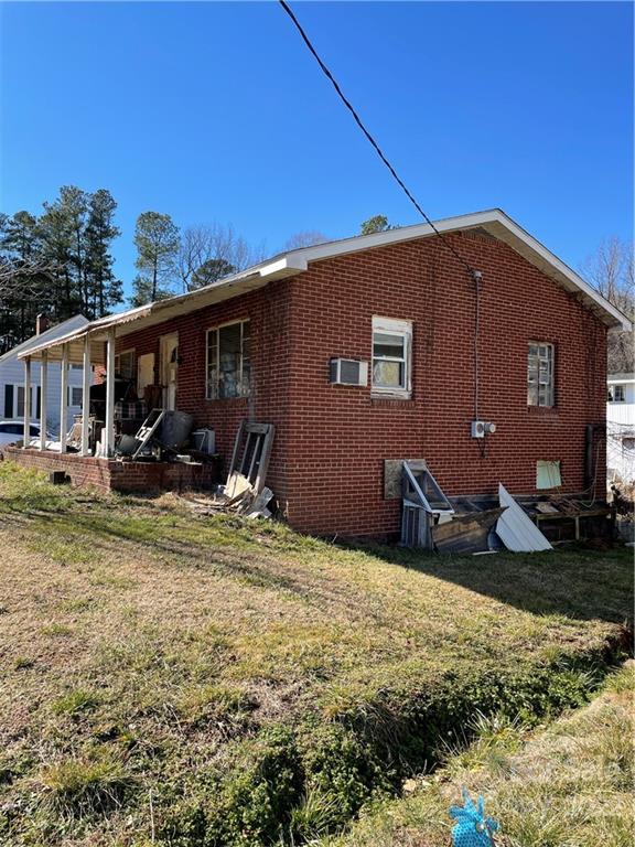 6230 Old Mocksville Road Salisbury, NC 28144 - Photo 2 of 2 a backyard of a house with yard and outdoor seating