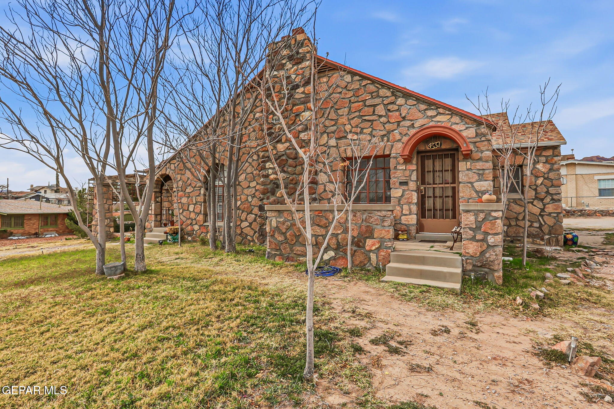 a view of a large house with a yard