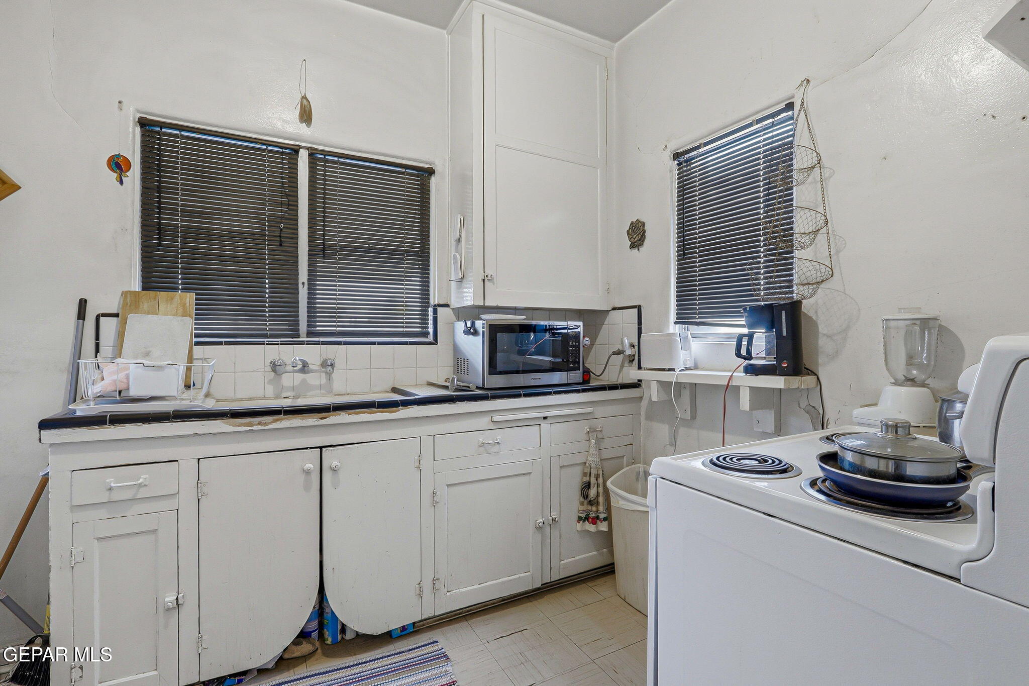 4333 Pershing Drive El Paso, TX 79903 - Photo 11 of 75 a kitchen with stainless steel appliances a sink stove and cabinets