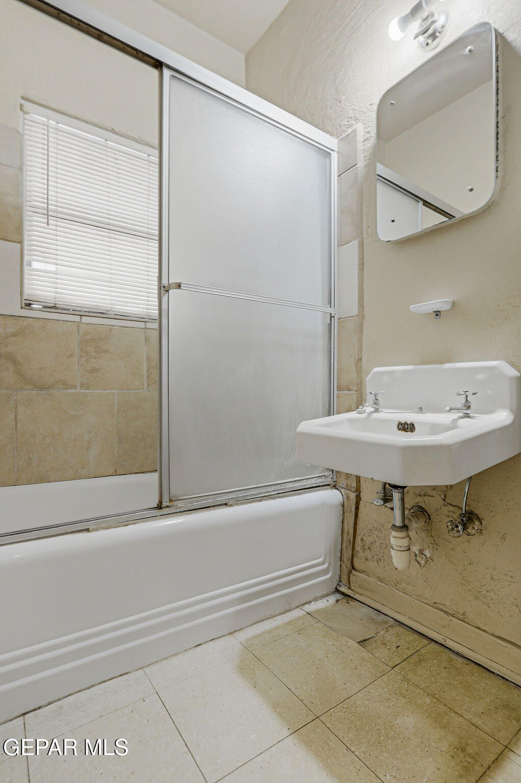 4333 Pershing Drive El Paso, TX 79903 - Photo 15 of 75 a bathroom with a sink and a mirror