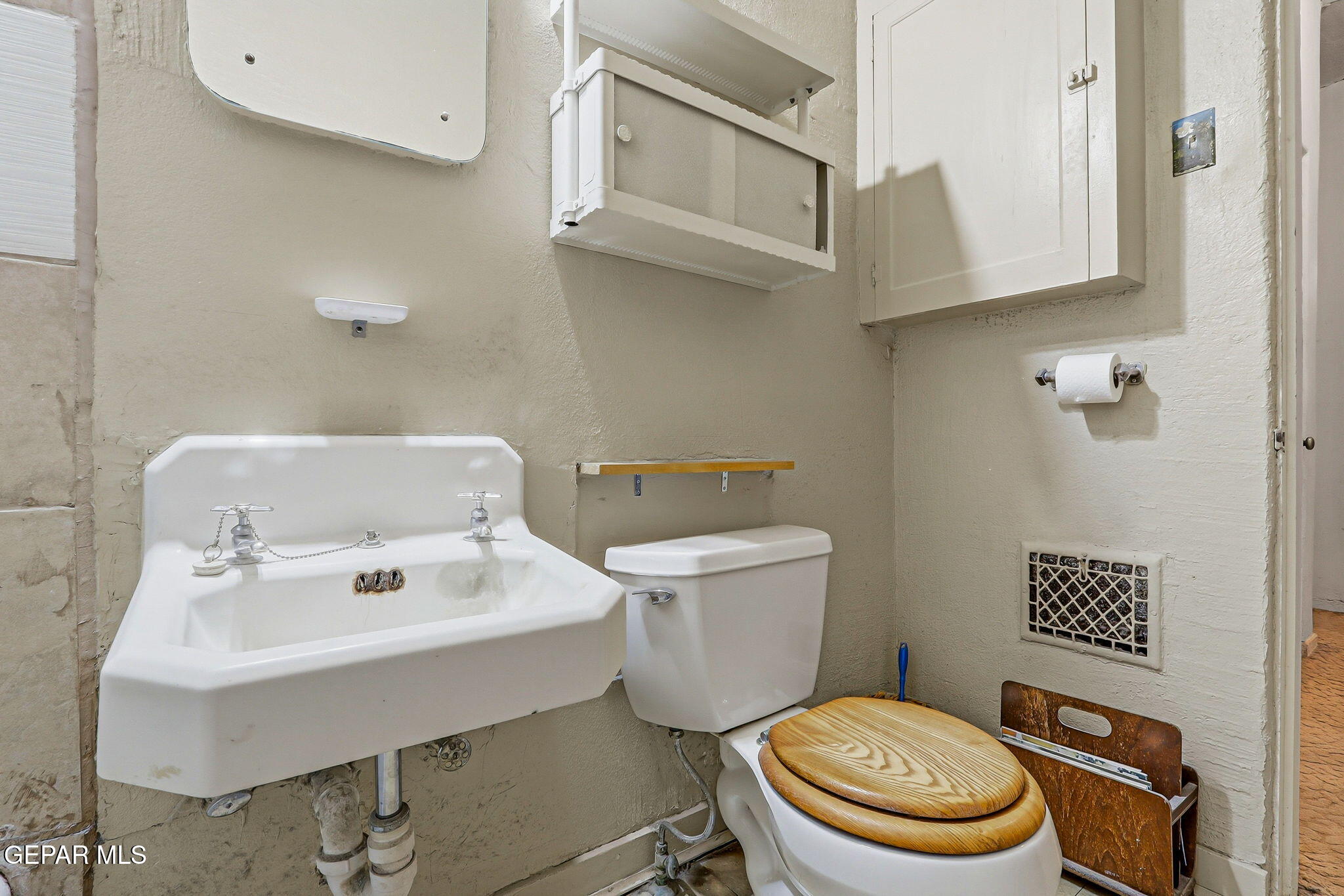 4333 Pershing Drive El Paso, TX 79903 - Photo 16 of 75 a white toilet sitting next to a bathroom sink