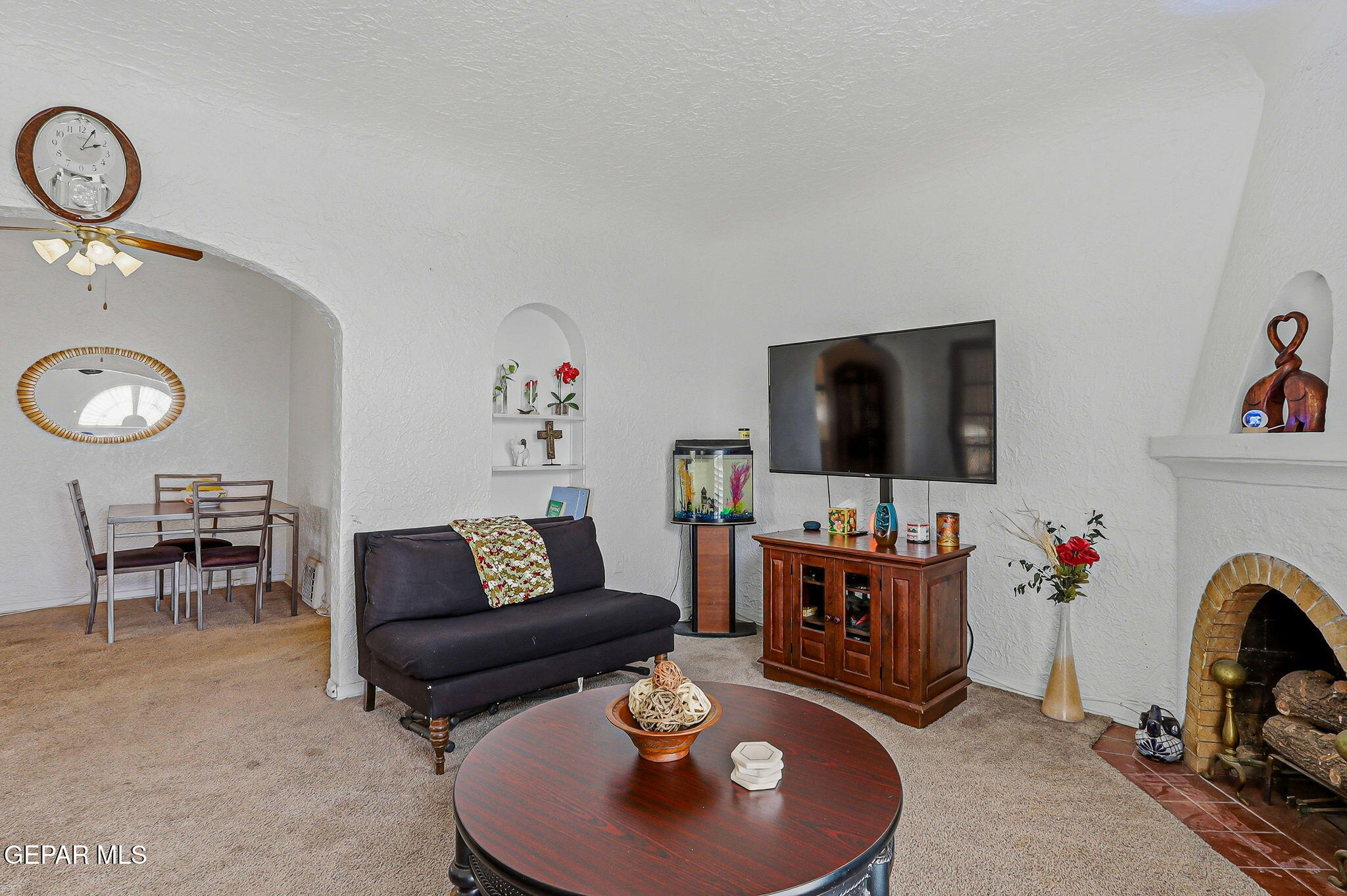 4333 Pershing Drive El Paso, TX 79903 - Photo 27 of 75 a living room with furniture and a flat screen tv