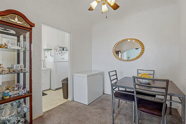 a bedroom with a bed and a television