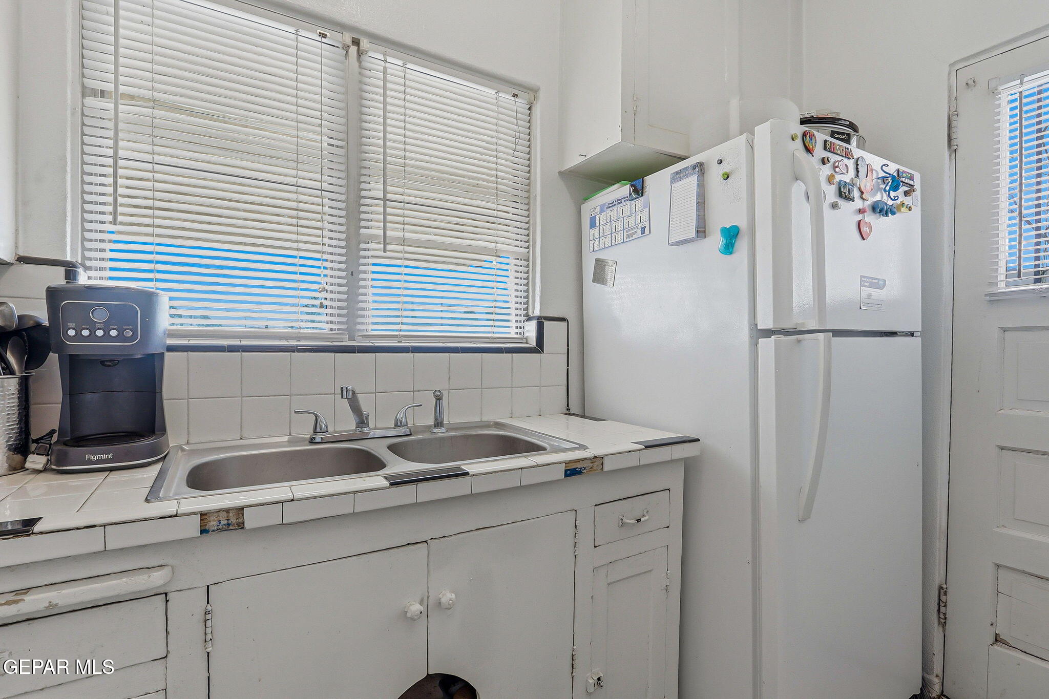 4333 Pershing Drive El Paso, TX 79903 - Photo 32 of 75 a white kitchen with sink and window