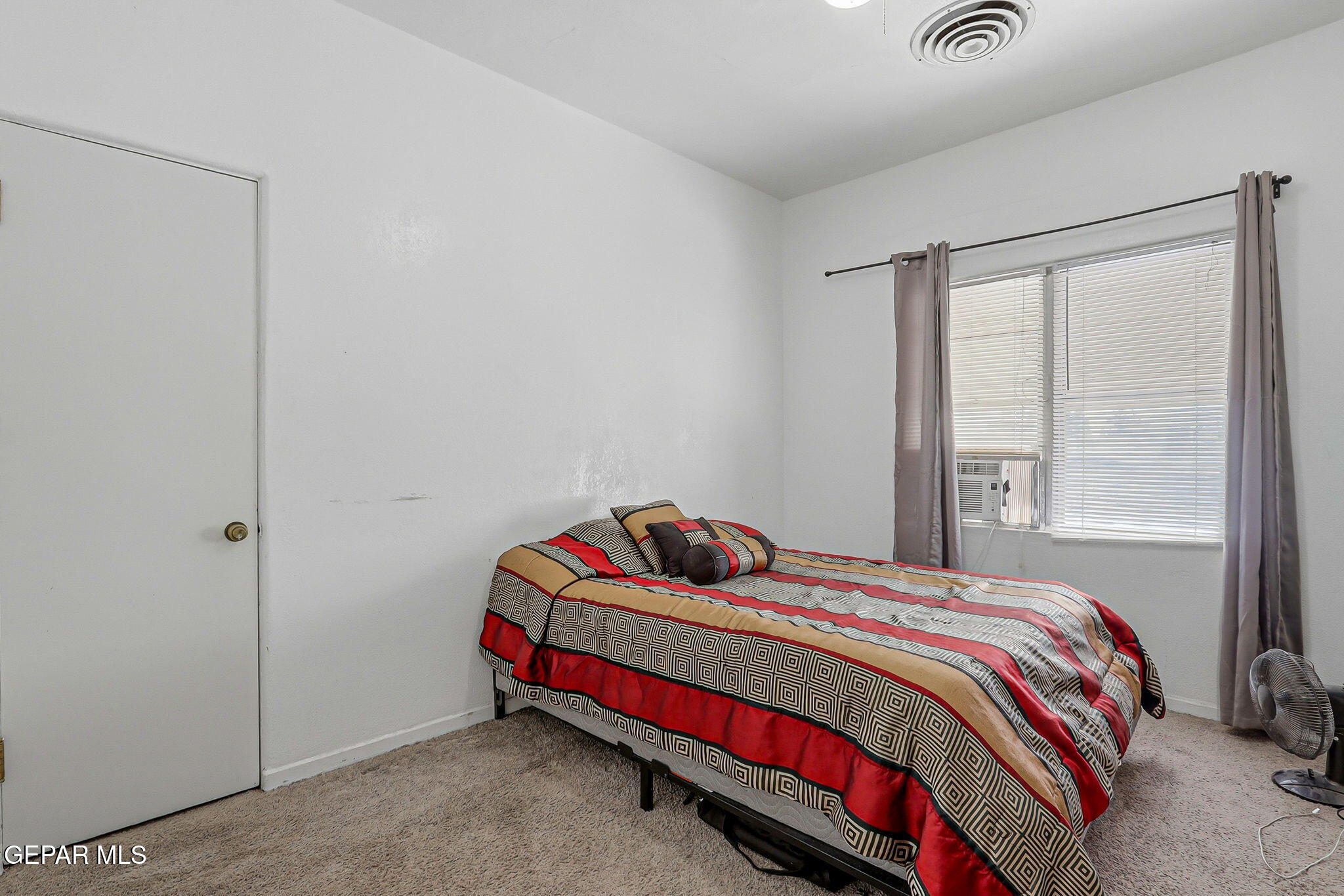 4333 Pershing Drive El Paso, TX 79903 - Photo 35 of 75 a bedroom with a bed and a window