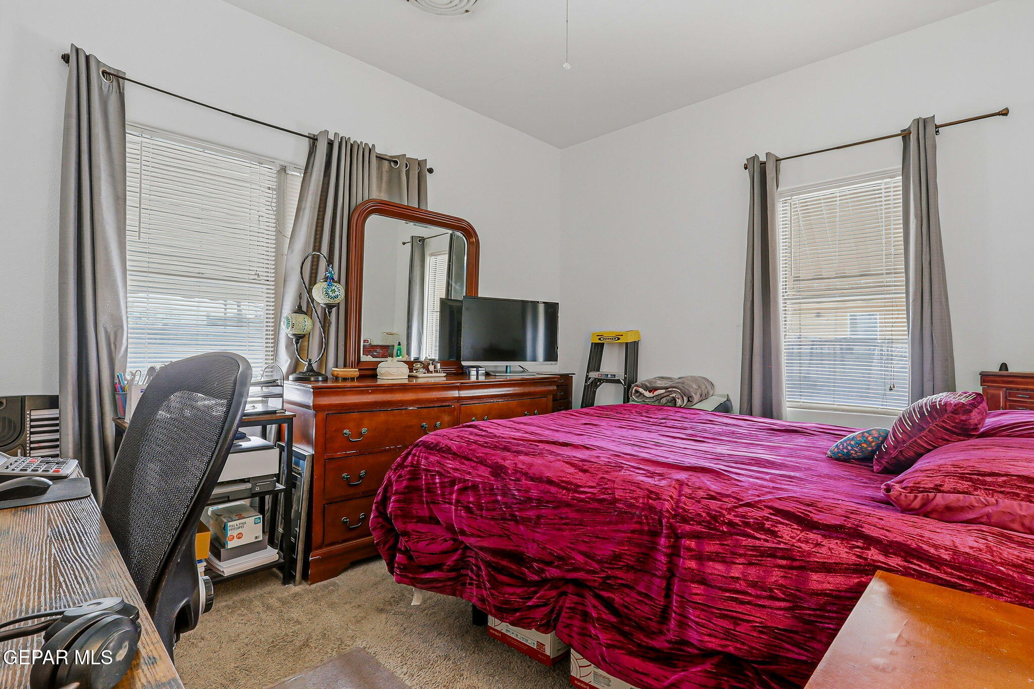 4333 Pershing Drive El Paso, TX 79903 - Photo 38 of 75 a bedroom with a bed and a chair