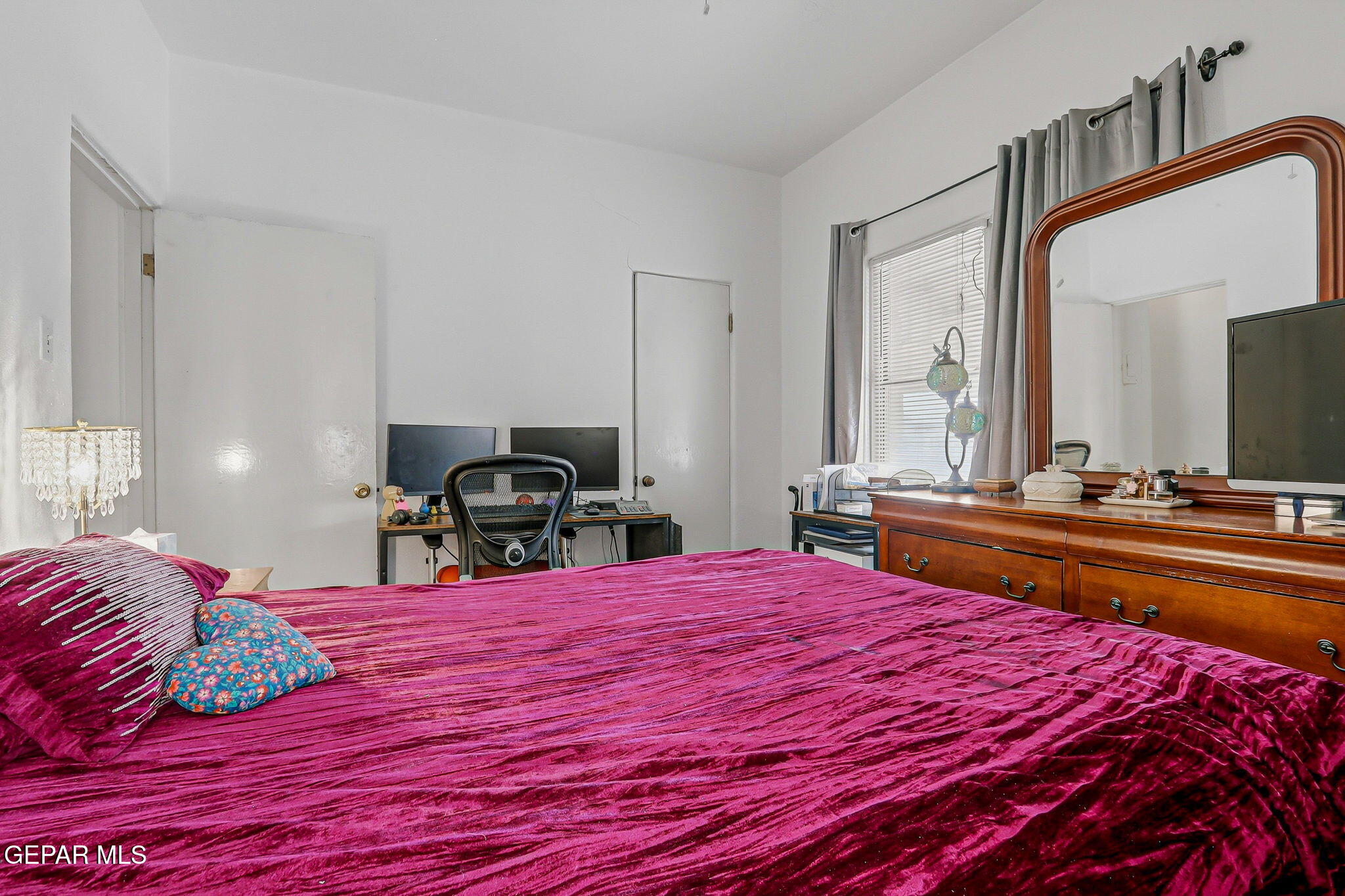 4333 Pershing Drive El Paso, TX 79903 - Photo 41 of 75 a bedroom with a bed and a large mirror