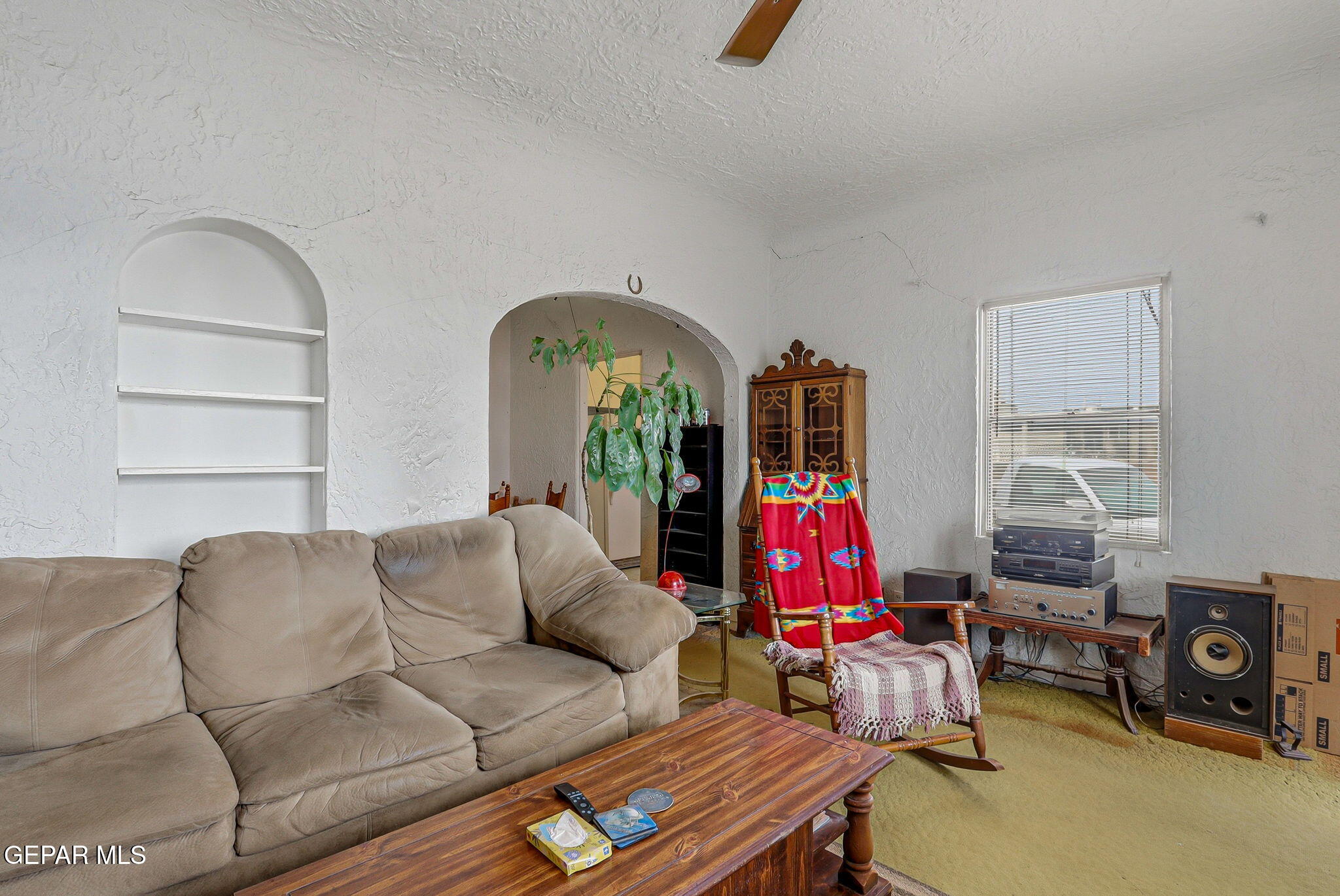 4333 Pershing Drive El Paso, TX 79903 - Photo 9 of 75 a living room with furniture a flat screen tv and a window