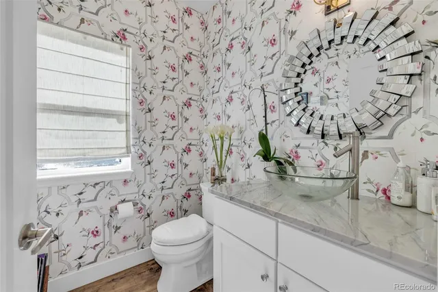 a view of a bathroom with toilet sink and a shower curtain