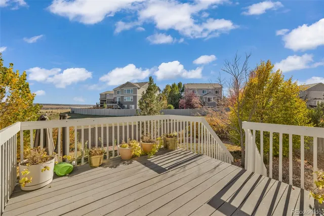 a view of deck with wooden floor and outdoor seating