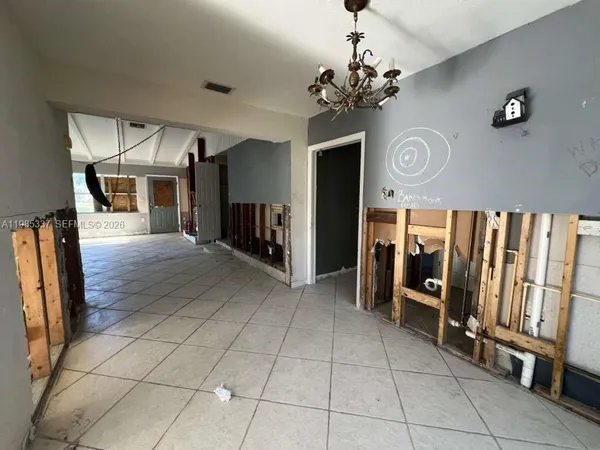 a view of a hallway with a chandelier