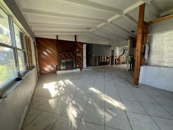 a view of a hallway with stairs